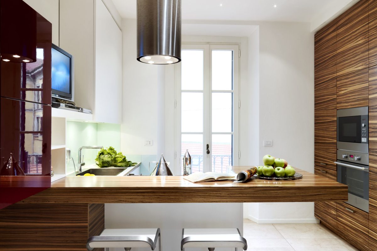 interior of a modern kitchen with snack table amd stool